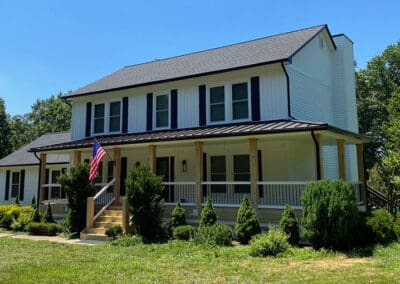 New roof two story white home